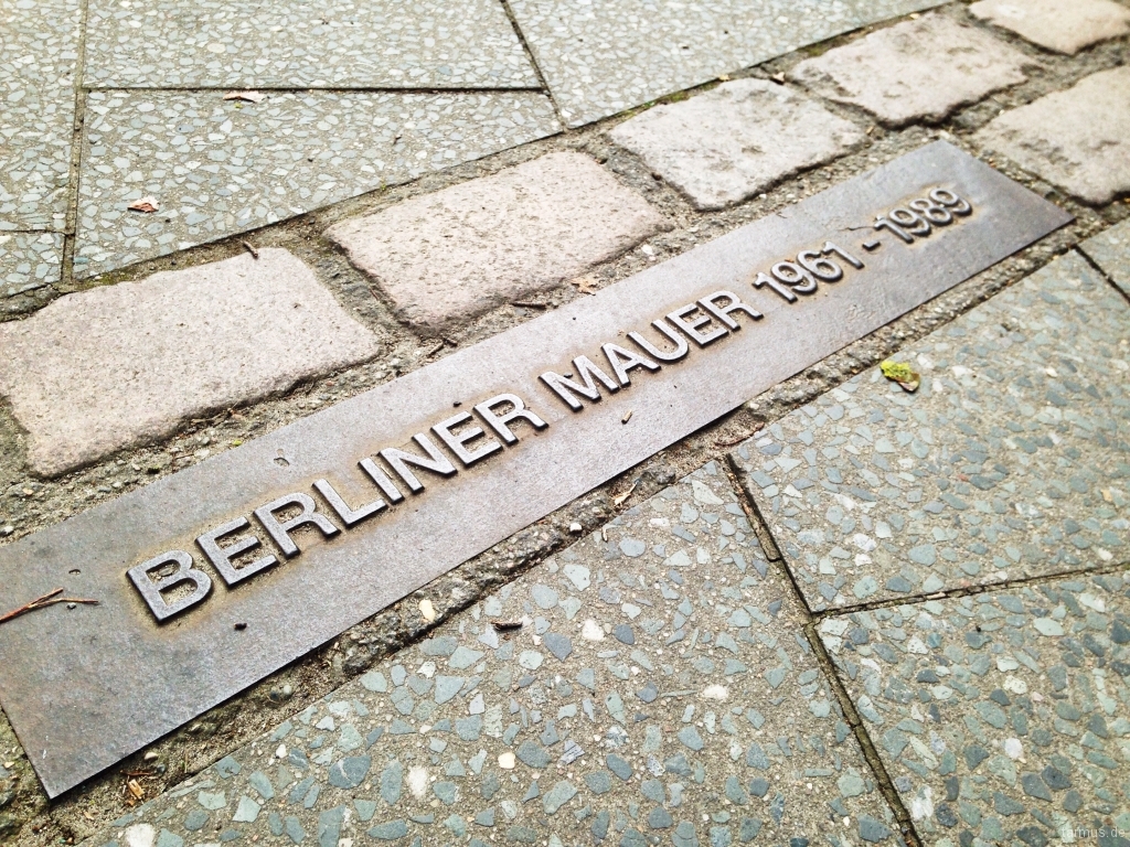 Berlin Wall cobblestone line on the pavement